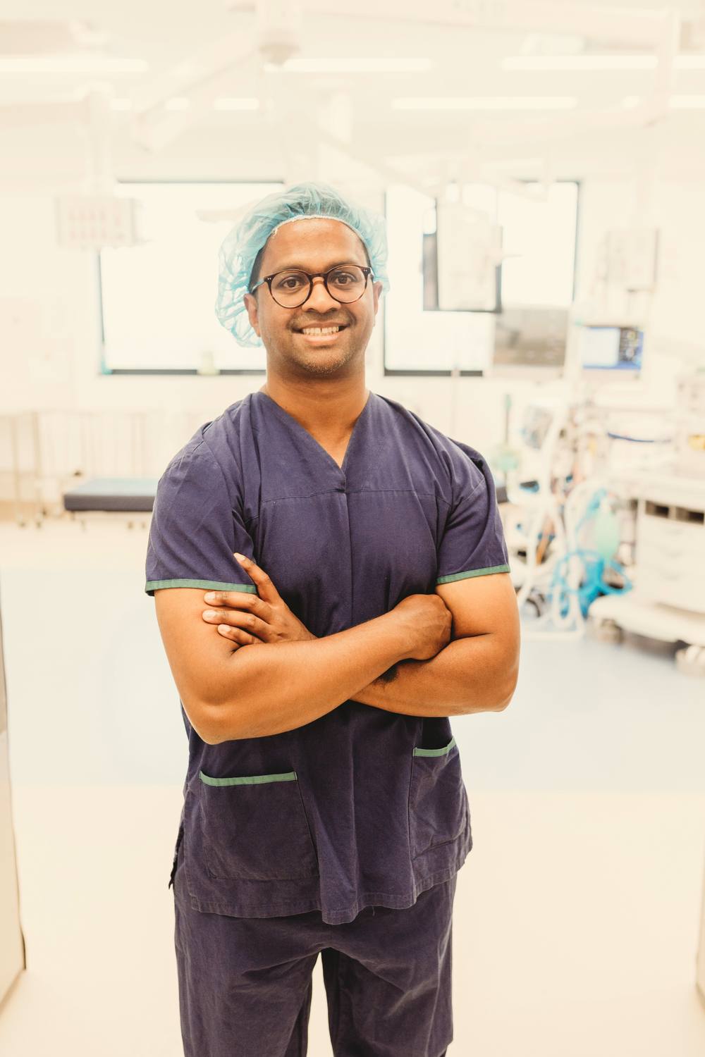 Dr Ravi Dissanayake in surgical scrubs at the operating theatre